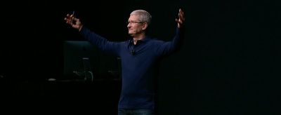 tim cook hands raised