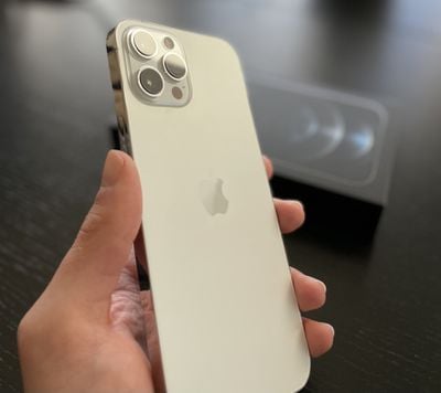 iphone 12 pro max gold in hand
