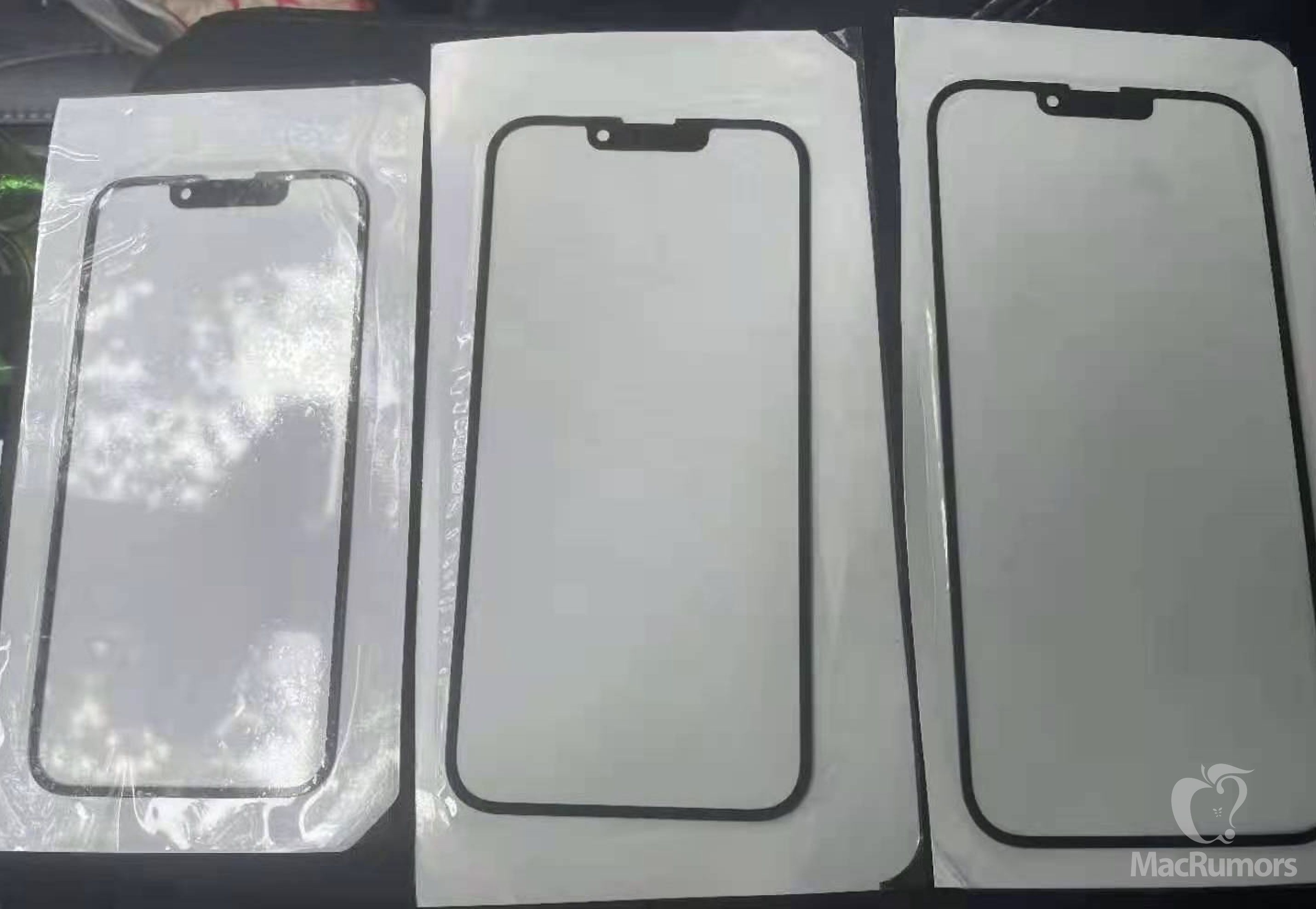 The front glass of the iPhone 13 reveals a smaller notch with the headset relocated to the top bezel
