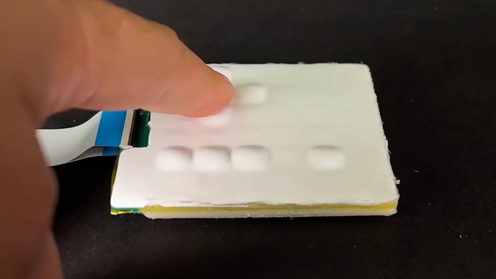 Researchers Develop New Tactile Technology That Could Enable a Pop-Up Keyboard on a Flat Smartphone Display