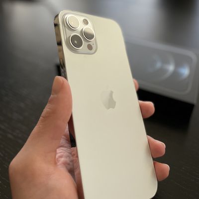 iphone 12 pro max gold in hand